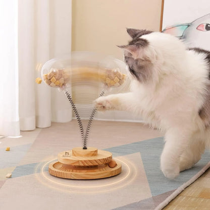 Juguete interactivo y atractivo para gatos con forma de bola con golosinas que gotea: divertido y estimulante, con pista de resorte de madera para mascotas, ideal para el desarrollo mental.